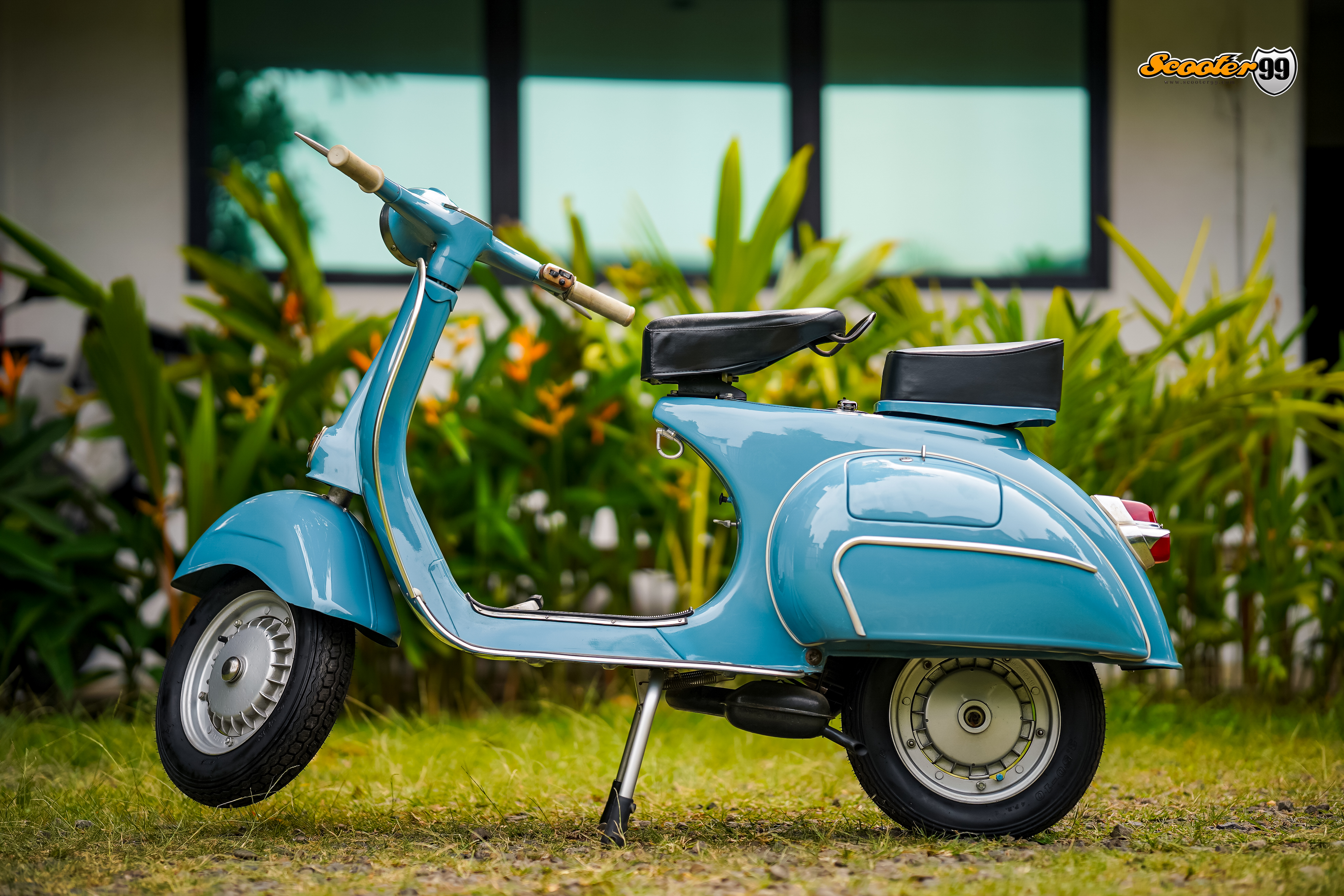 Side profile of restored Vespa 150 Medium Blue